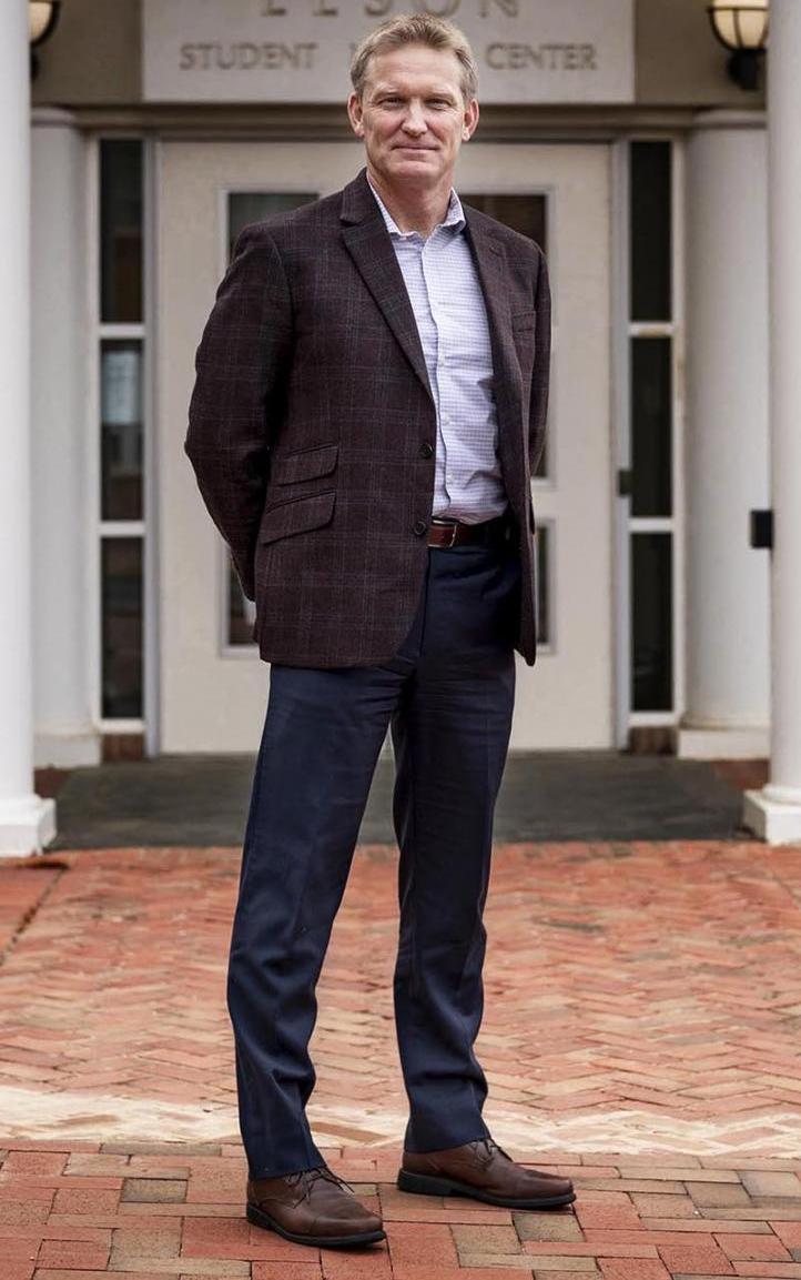 Chris Holstege stands in front of a building.