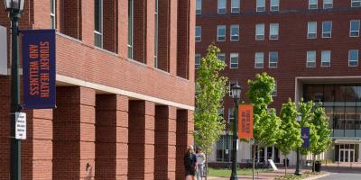 students walking outside building